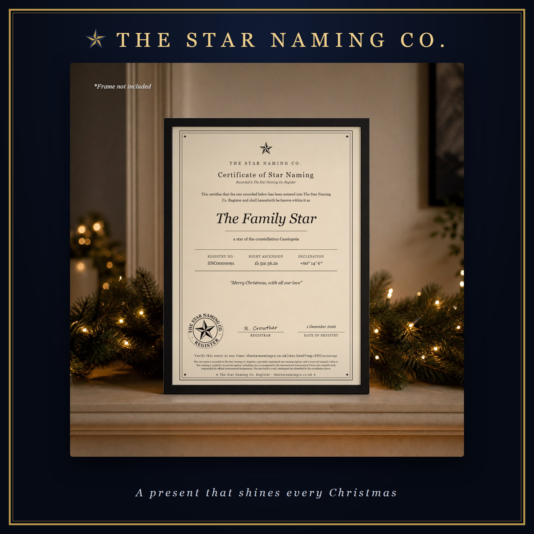 A framed Certificate of Star Naming for The Family Star on a mantelpiece with Christmas garland and fairy lights, in The Star Naming Co. frame.